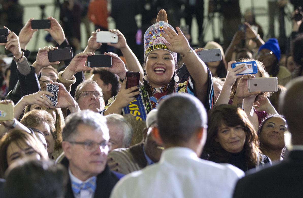 JANUARY 22 - BOISE, IDAHO: A woman dressed in Native American dress waves as U.S. President Barack Obama greets people in the audience at Boise State University. Obama gave a speech about the themes of his <a href="http://cnn.com/2015/01/20/politics/state-of-the-union-address-2015-preview/">State of the Union address. </a>