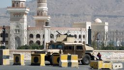 A Shiite Huthi militiaman sits near a tank confiscated from the army in the area around the presidential palace in the capital Sanaa, on January 22.