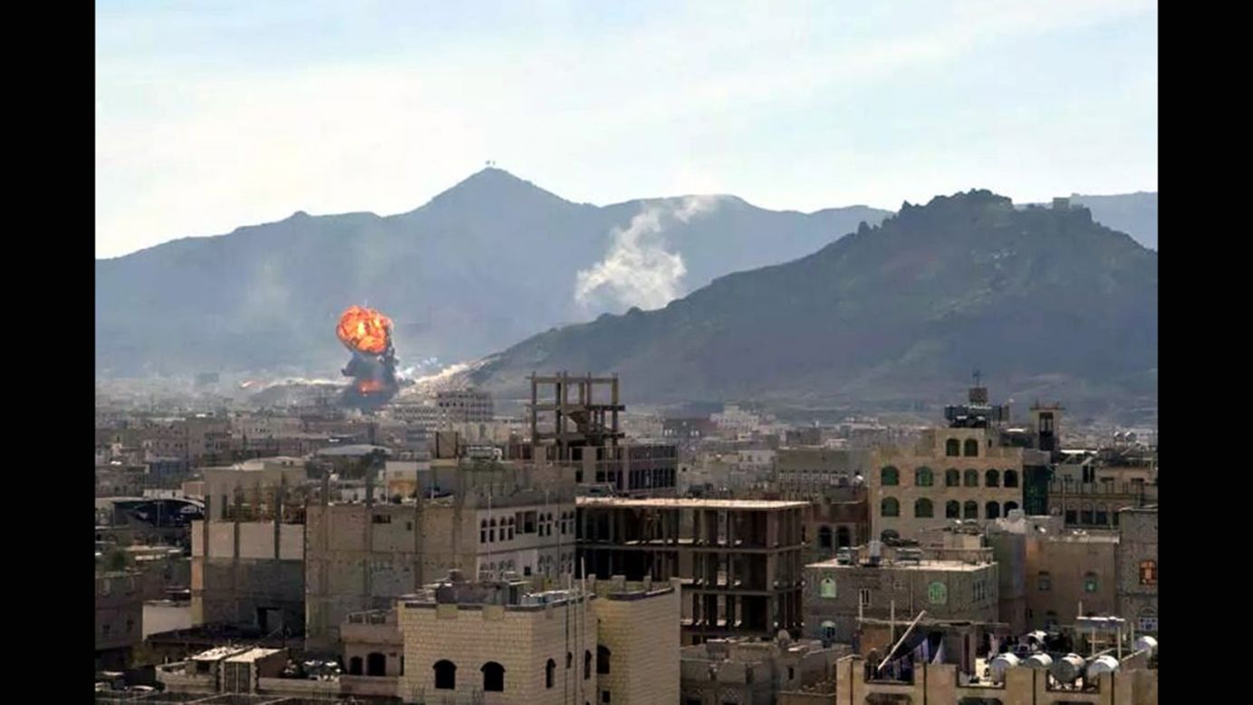 Smoke and flames rise in Sanaa, Yemen, during heavy clashes between presidential guards and Houthi rebels on Monday, January 19. Yemeni President Abdu Rabu Mansour Hadi, Prime Minister Khaled Bahah and the country's Cabinet resigned several days later.