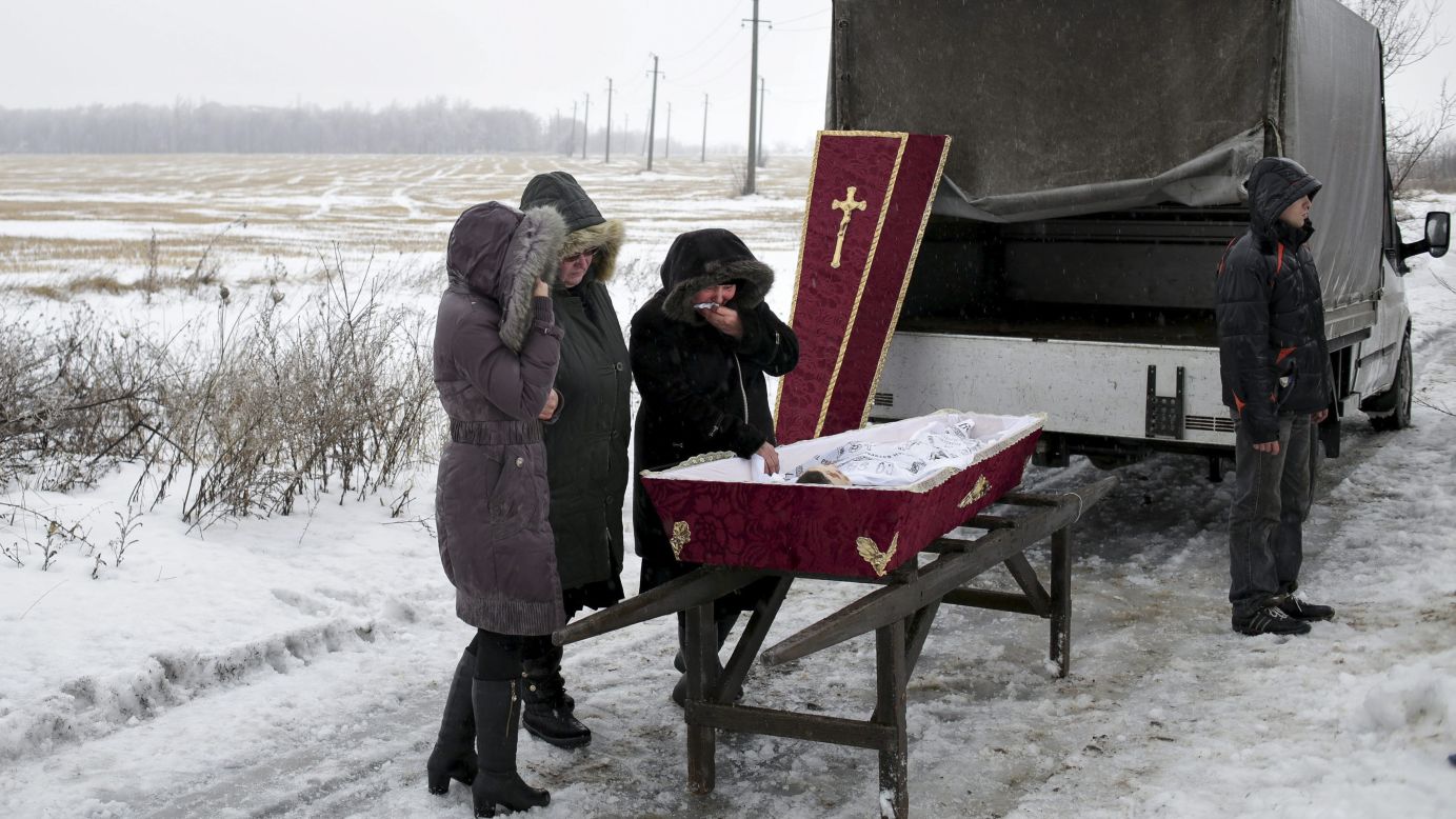 Relatives attend the funeral of 11-year-old Artem Lytkin, who was killed during shelling in Debaltseve, Ukraine, on Monday, January 19. <a href="http://www.cnn.com/2015/01/23/world/gallery/ukraine-crisis-2015/index.html" target="_blank">Fighting between Ukrainian troops and pro-Russian rebels</a> has left thousands dead since mid-April.