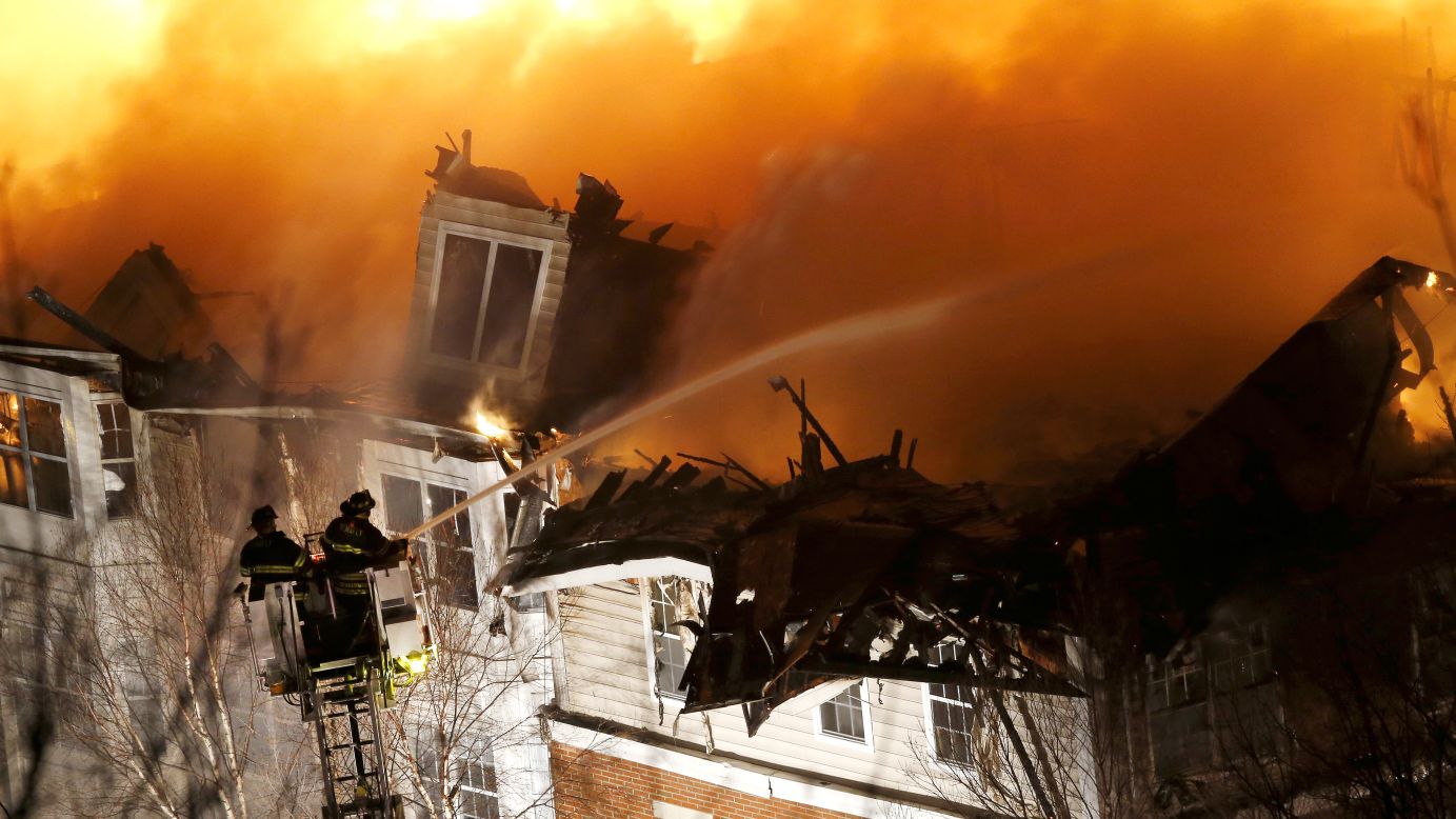 Firefighters stand on a ladder while spraying water onto an apartment complex in Edgewater, New Jersey, on Wednesday, January 21. The fire <a href="http://www.cnn.com/2015/01/22/us/new-jersey-apartment-fire/index.html" target="_blank">consumed 240 apartments</a> and permanently displaced up to 500 residents, according to Edgewater Mayor Michael McPartland.