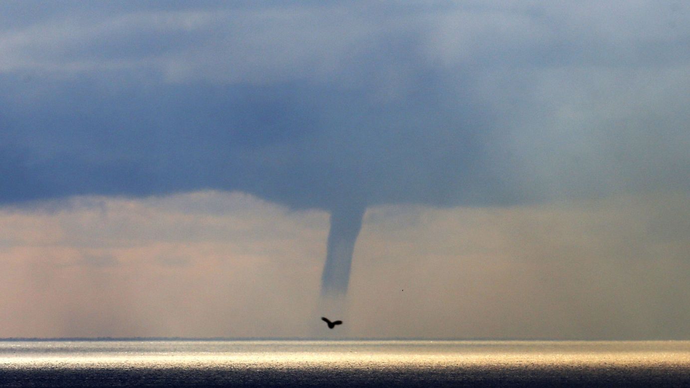 A waterspout forms above the Mediterranean Sea, off the coastal city of Nice, France, on Monday, January 19.