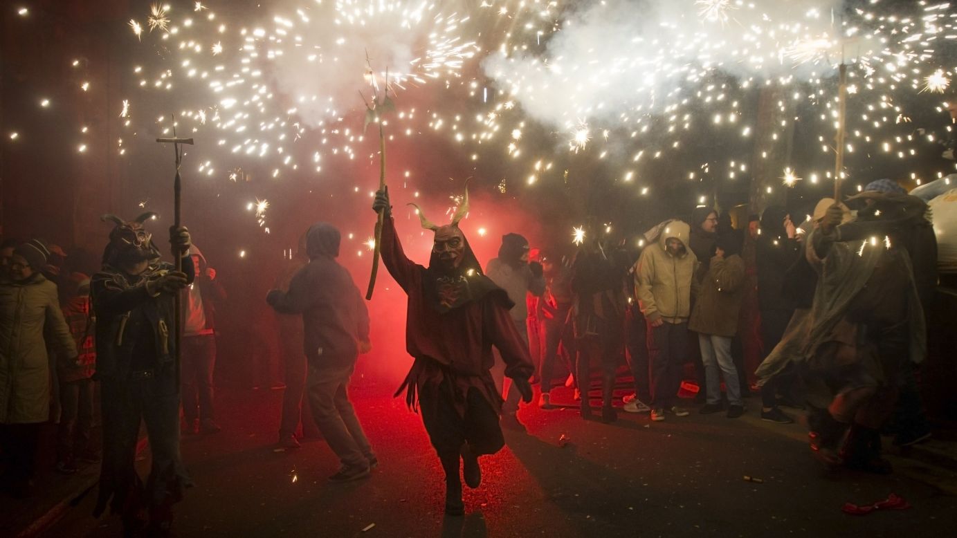 A reveler wearing a demon costume takes part in the traditional Correfoc festival in Palma de Mallorca, Spain, on Saturday, January 17. During the Correfoc, participants dress as demons and devils and move through the streets scaring people with fire and fireworks.
