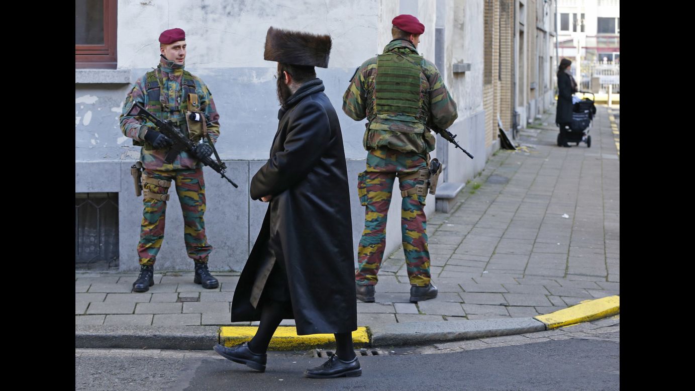 Belgian paratroopers keep guard outside a Jewish school in Antwerp, Belgium, on Saturday, January 17. Security was tightened in many parts of the country after an <a href="http://www.cnn.com/2015/01/15/world/gallery/belgium-anti-terror-operation/index.html" target="_blank">anti-terror operation</a> in the city of Verviers on January 15.
