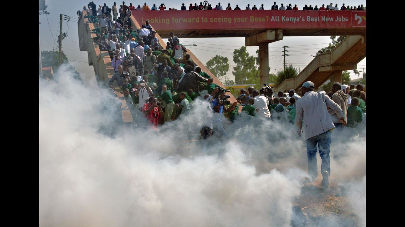 Children from the Langata Road Primary School scramble up a bridge to escape tear gas after <a href="http://www.cnn.com/2015/01/20/africa/kenya-playground-children-tear-gassed/index.html" target="_blank">police attempted to break up a demonstration</a> Monday, January 19, in Nairobi, Kenya. The children were among those protesting against the removal of the school's playground.