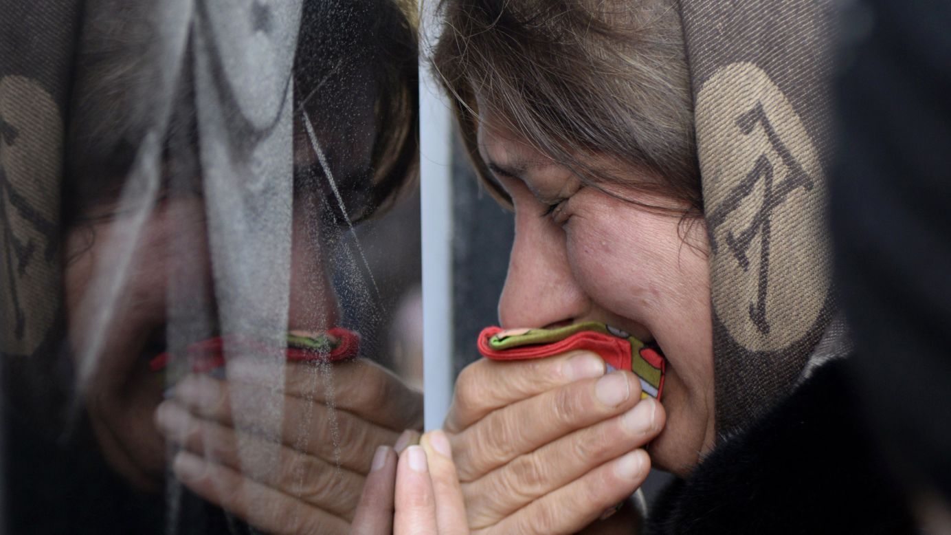 A woman in Baku, Azerbaijan, cries Tuesday, January 20, at the Alley of Martyrs, a cemetery and memorial dedicated to those killed by Soviet troops during the Black January crackdown in 1990.