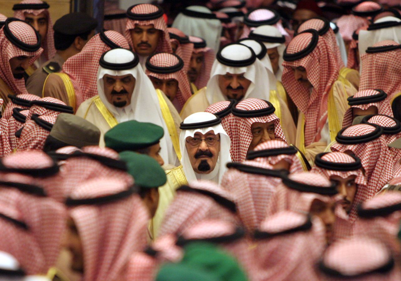 King Abdullah is surrounded by hundreds of Islamic clerics, tribal chiefs and other prominent Saudis before a ceremony bestowing his legitimacy in August 2005.
