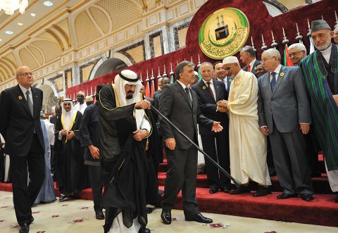 King Abdullah is escorted by Turkish President Abdullah Gul as Lebanese Prime Minister Najib Mikati, left, walks alongside them during a summit in Mecca, Saudi Arabia, in August 2012.