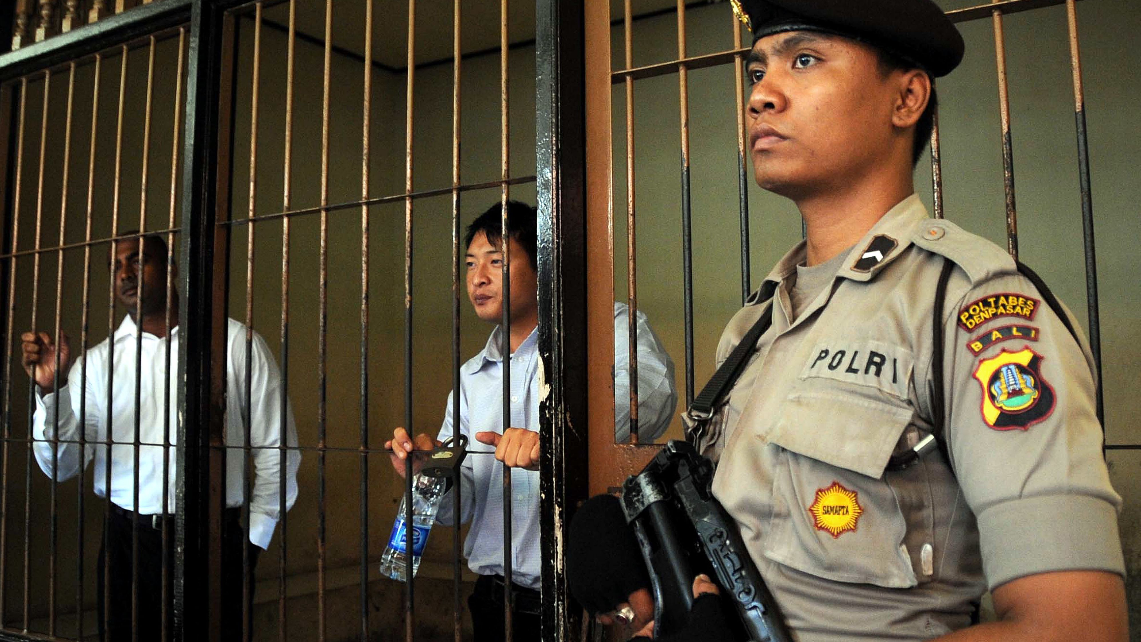 Australians Myuran Sukumaran, left, and Andrew Chan, center, part of the "Bali Nine" await trial in 2010 in Bali. 