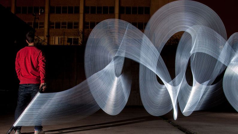 Birmingham-based photographer Peter Medlicott is more commonly known on the streets by his artistic alter ego, "Sola." Under his  pseudonym, he has been creating intense light sculptures. But in the blink of an eye, they are gone. 
