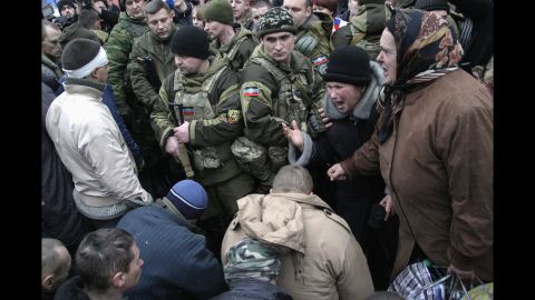 People in downtown Donetsk react as Ukrainian prisoners of war are handed over by pro-Russian rebels on January 22.