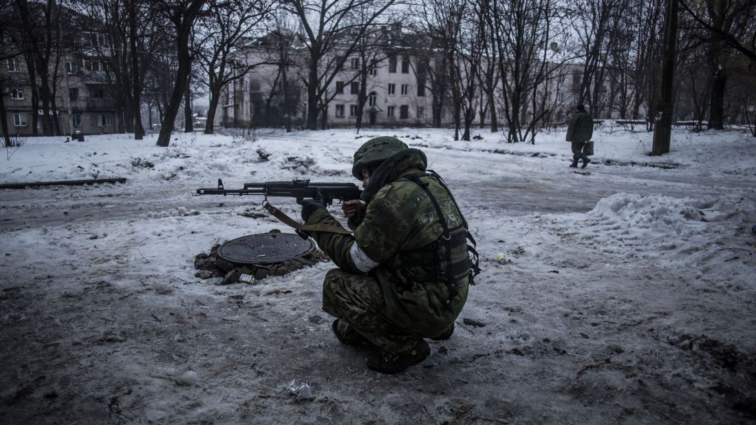 A rebel takes aim while protecting a supply position in the Kievsky district of Donetsk on January 22.