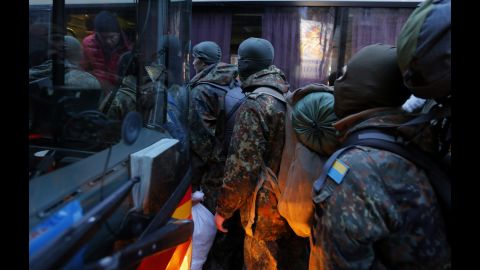 Men from the Azov Volunteer Battalion board a bus in Kiev to join the fight against the rebels on Saturday, January 17.