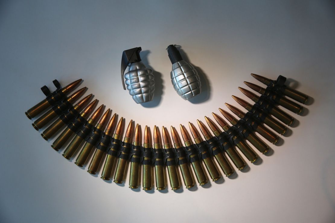 Fake grenades and ammunition is displayed after being confiscated at airport security checkpoints at the JFK International Airport on November 18, 2014, in New York City.