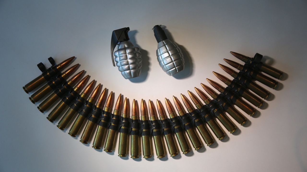 Fake grenades and ammunition is displayed after being confiscated at airport security checkpoints at the JFK International Airport on November 18, 2014, in New York City.
