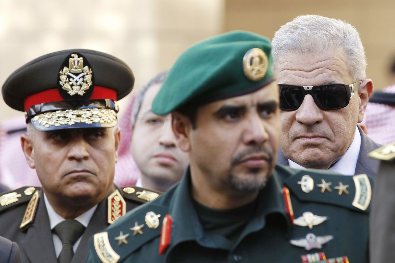 Egyptian Prime Minister Ibrahim Mahlab, right, and Egyptian Defense Minister Gen. Sedki Sobhi, left, arrive at the mosque to attend the funeral.