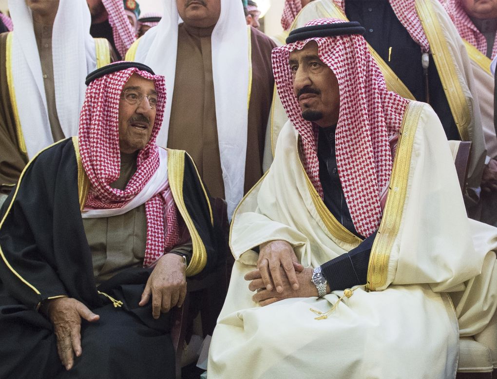 Saudi Arabia's new King Salman, right, talks with Kuwait's Emir, Sheikh Sabah Al-Ahmad Al-Jaber Al-Sabah, during King Abdullah's funeral.