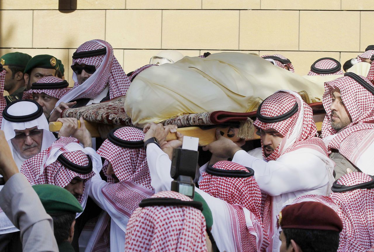 Mourners carry the King's body outside a mosque in Riyadh on January 23.