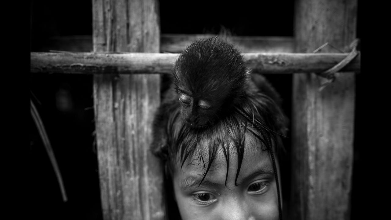 Apartya with a pet monkey on his head.