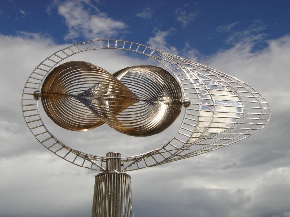 "Ad Infinitum" -- the name for this sculpture comes from the idea that it will turn endlessly in the wind. The core of the piece consists of 36 intersecting discs of metal, which represent 360 degrees of freedom. "The "Infinity Center" is designed to look like the mathematical symbol ∞ for Infinity," explains Gschwend on his website. "Due to the intricate design and assembly, the view of it is ever changing, as it rotates simultaneously on multiple axis."  