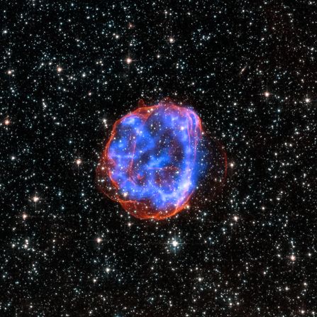 When a massive star exploded in one of our neighboring galaxies, known as the Large Magellanic Cloud, an expanding debris field with the catchy name of SNR 0519-69.0 was left in its wake. In this image, you can actually see the edge of the detonation in red surrounding the multimillion-degree gas captured in blue by the Chandra X-ray observatory.
