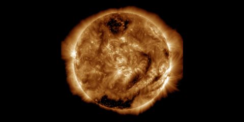 We also saw the 100 millionth image of the Sun taken at NASA's Solar Dynamics Observatory on January 19, 2015. The image's darker regions are areas of less dense gas known as coronal holes, where solar material is moving away from the Sun.