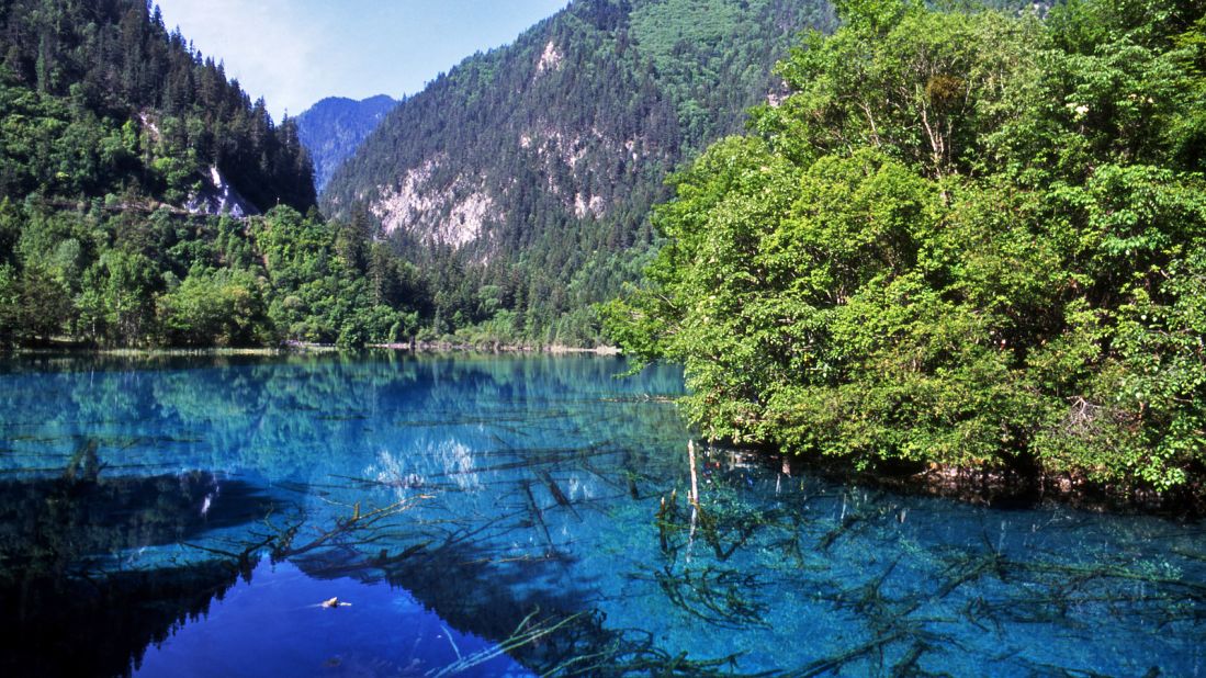 <strong>Jiuzhaigou National Park, Sichuan Province, China: </strong>You can enjoy all the vibrant colors of nature at China's Jiuzhaigou National Park. Look out for the ancient tree trunks under the clear waters of Five Flower Lake. 