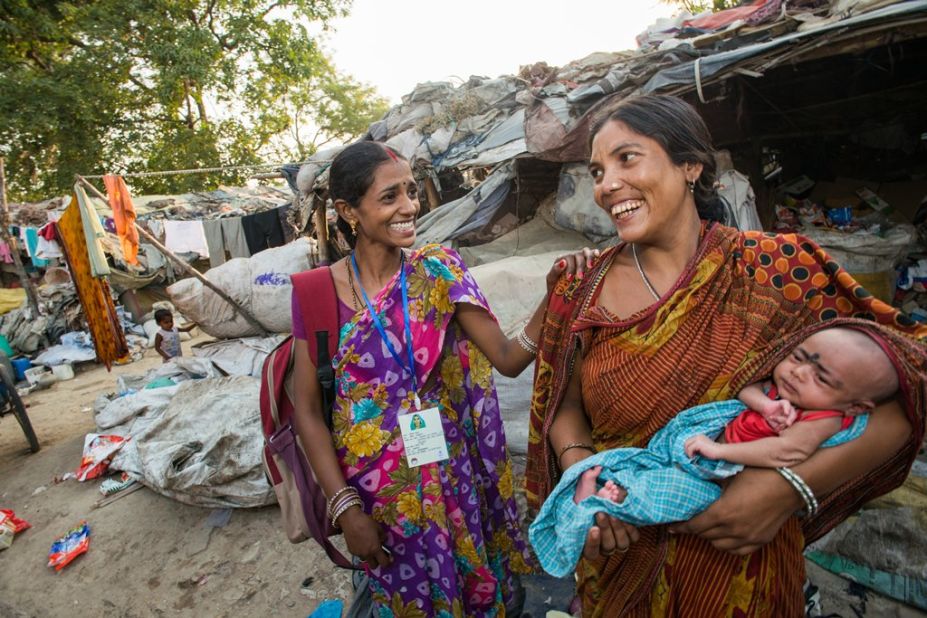 An ASHA worker visits the Chandan slum to discuss general health concerns and family planning practices with residents in Uttar Pradesh, India, on June 4, 2014. 