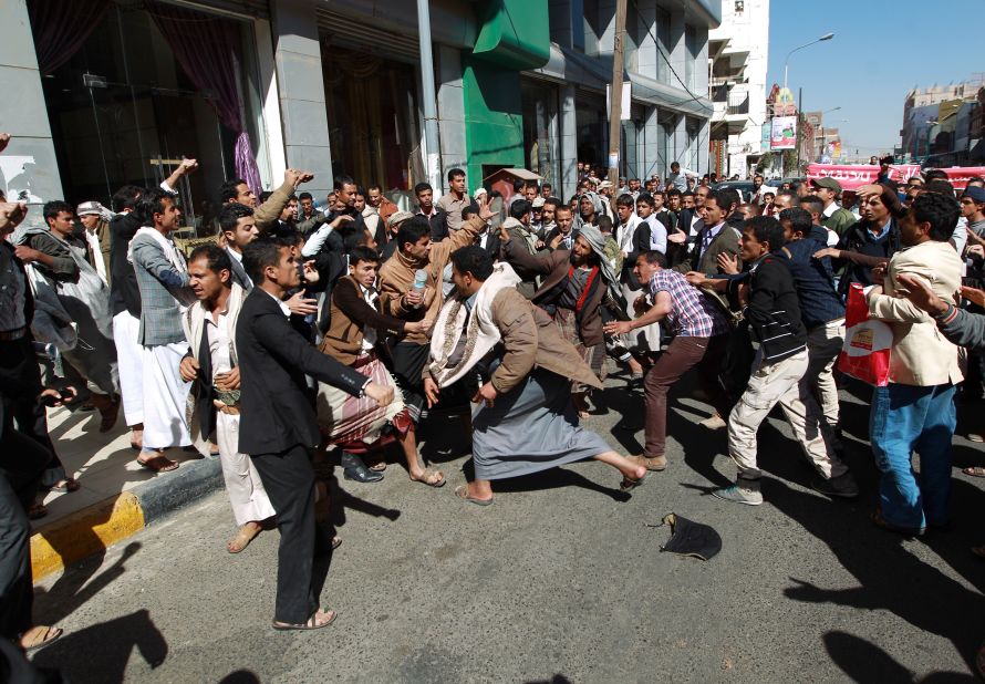 Houthi rebels fight with Yemeni protesters during a rally in Sanaa on January 24. Thousands of Yemenis took to the streets of Sanaa in the largest demonstration against Houthis since the Shiite militiamen overran the capital in September.  