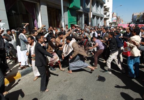 Houthi rebels fight with Yemeni protesters during a rally in Sanaa on January 24. Thousands of Yemenis took to the streets of Sanaa in the largest demonstration against Houthis since the Shiite militiamen overran the capital in September.  
