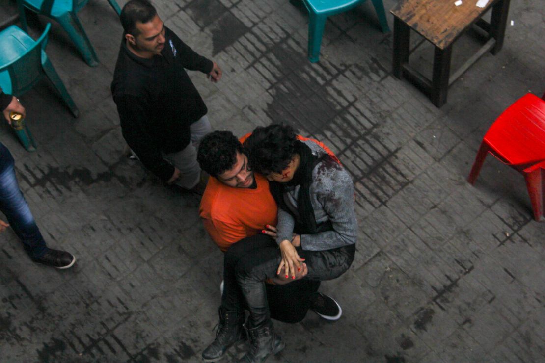 A protester carries Shaimaa El-Sabbagh, who was killed during a protest in Cairo on Saturday.