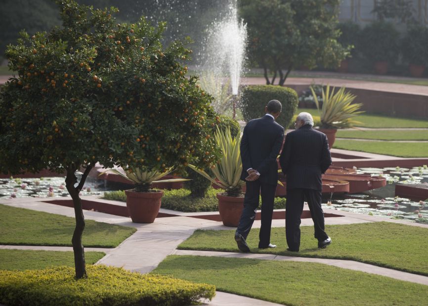  Obama and Modi walk in the gardens of the Hyderabad House.