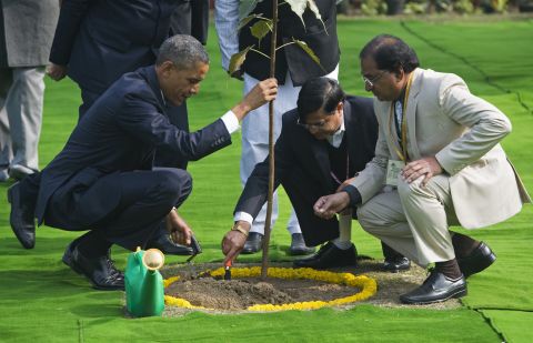 Obama participates in a tree planting ceremony at Raj Ghat, the Mahatma Gandhi Memorial.