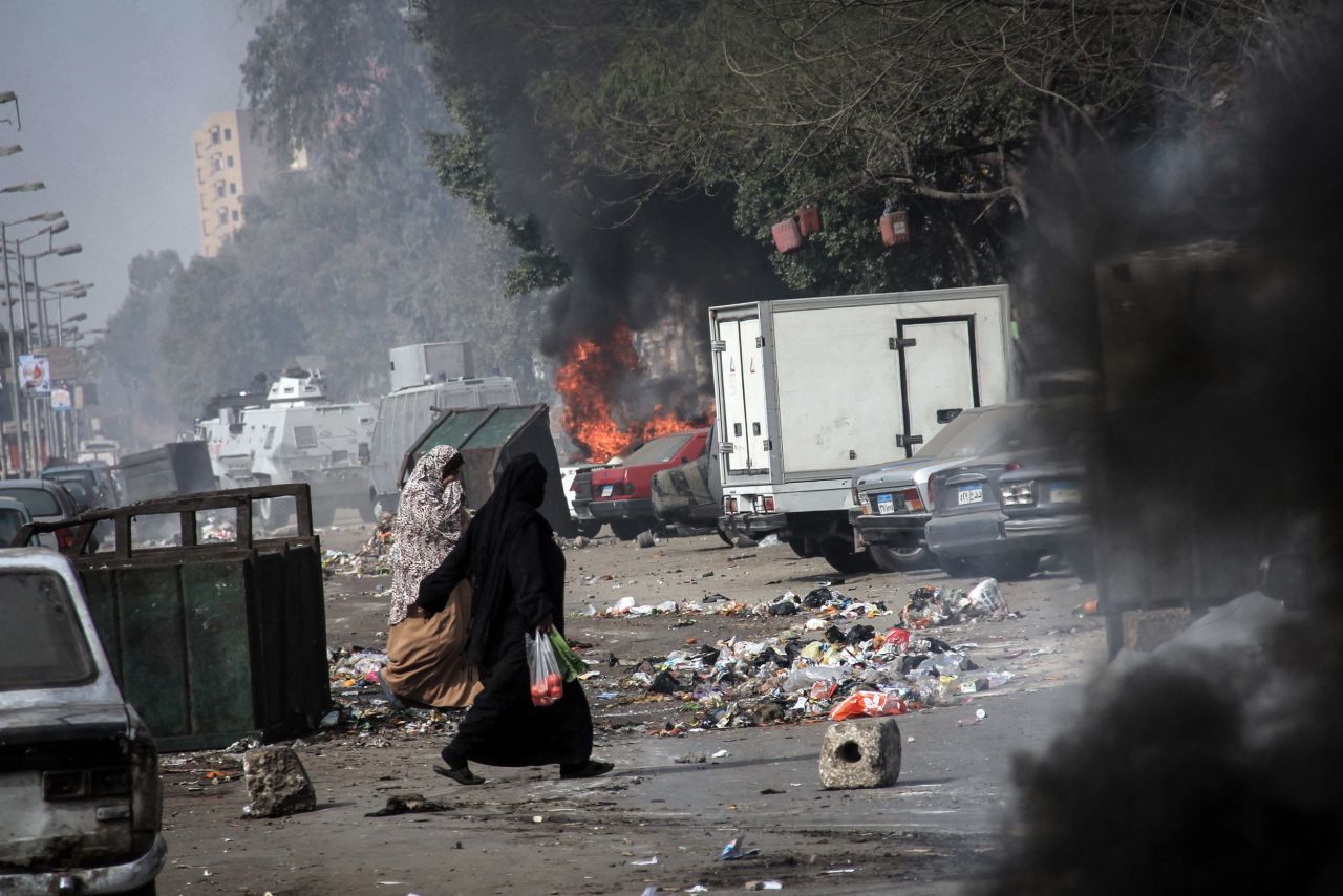 Smoke rises as a car burns in Cairo on January 25.