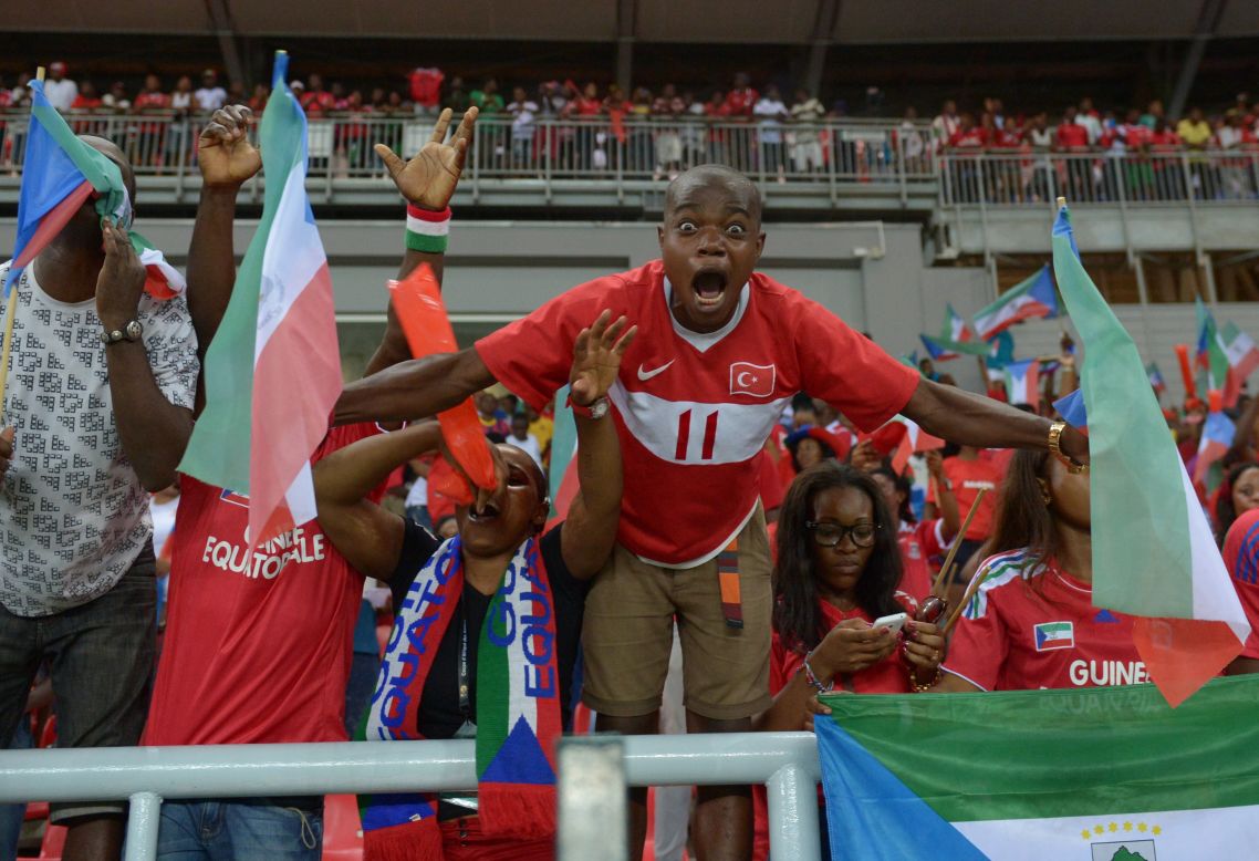 Equatorial Guinea fans celebrated wildly after their team reached the knockout stages of the Africa Cup of Nations on home soil.