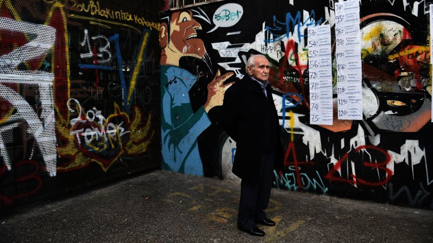 A man arrives at a polling station in Athens on January 25, 2015, as Greece votes in a general election that could bring the anti-austerity Syriza party to power and lead to a renegotiation of the country's international bailout.