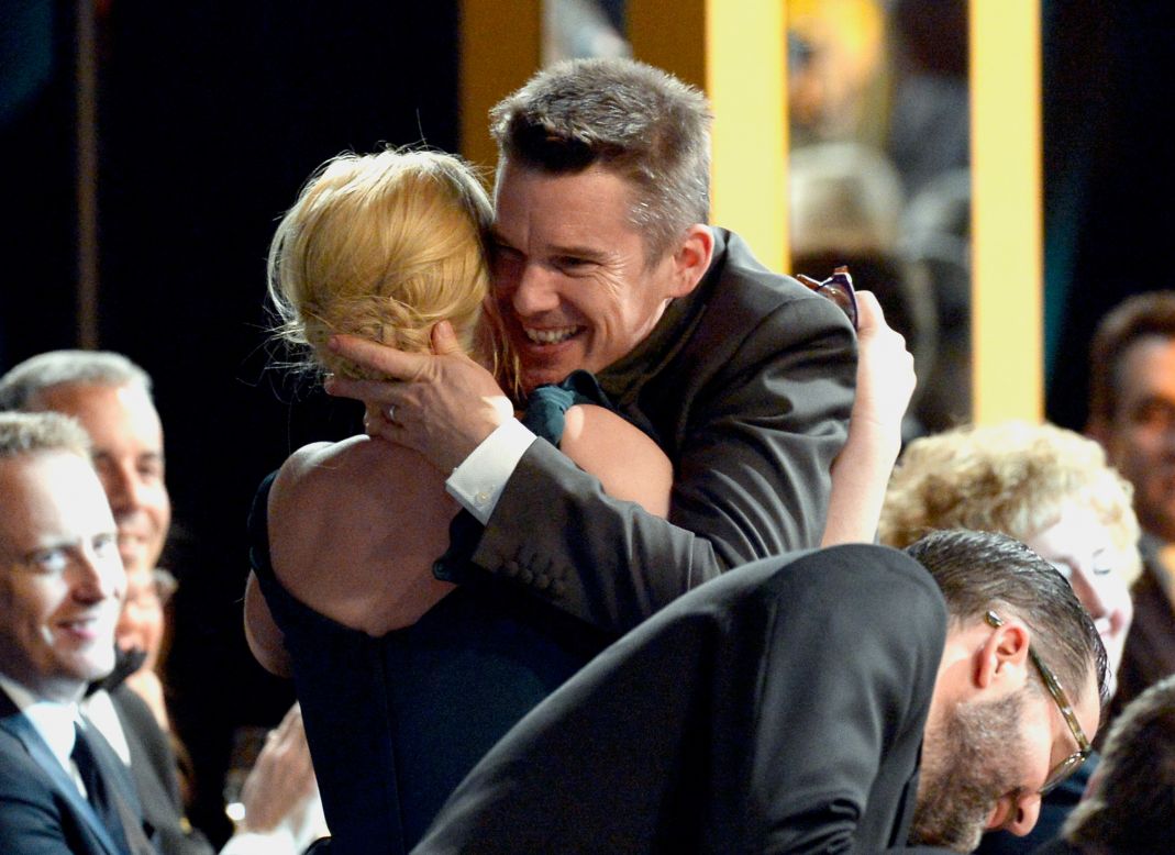 Ethan Hawke embraces "Boyhood" co-star Patricia Arquette. She won outstanding actress in a supporting role.