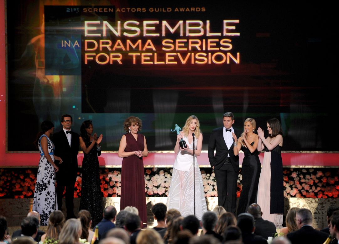 Joanne Froggatt, center, and the cast of "Downton Abbey" accept the award for outstanding ensemble in a drama series.
