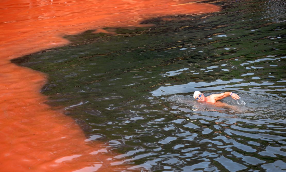 A swimmer heads towards a red algae bloom at Sydney's Clovelly Beach on November 27, 2012.