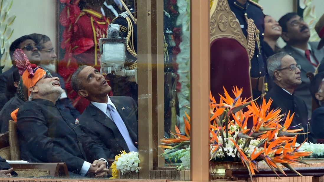 Modi talks with Obama as they watch jets fly overhead during the Republic Day parade on January 26.