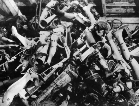 Prosthetic limbs taken from executed prisoners are seen in a pile at the camp. 