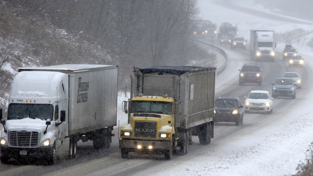 Traffic moves through falling snow near Evans City, Pennsylvania, on January 26.