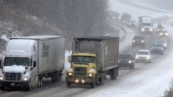 Traffic moves through the falling snow near Evans City, Pennsylvania, on January 26.