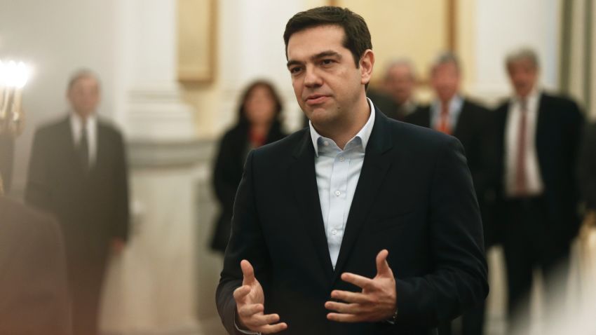 Greece's Prime Minister Alexis Tsipras, makes a secular oath to the Greek President Karolos Papoulias at the Presidential Palace in Athens, Monday, Jan. 26, 2015.