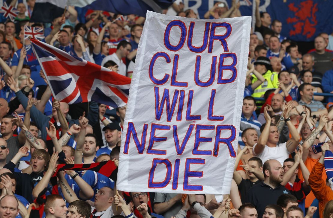 Rangers fans display a banner declaring their club will live on despite administration followed by liquidation in 2012.