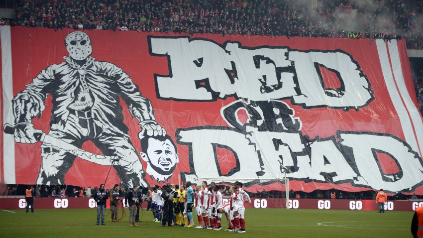 Standard Liege fans display a banner depicting the decapitation of Anderlecht midfielder Steven Defour before the Jupiler Pro League match