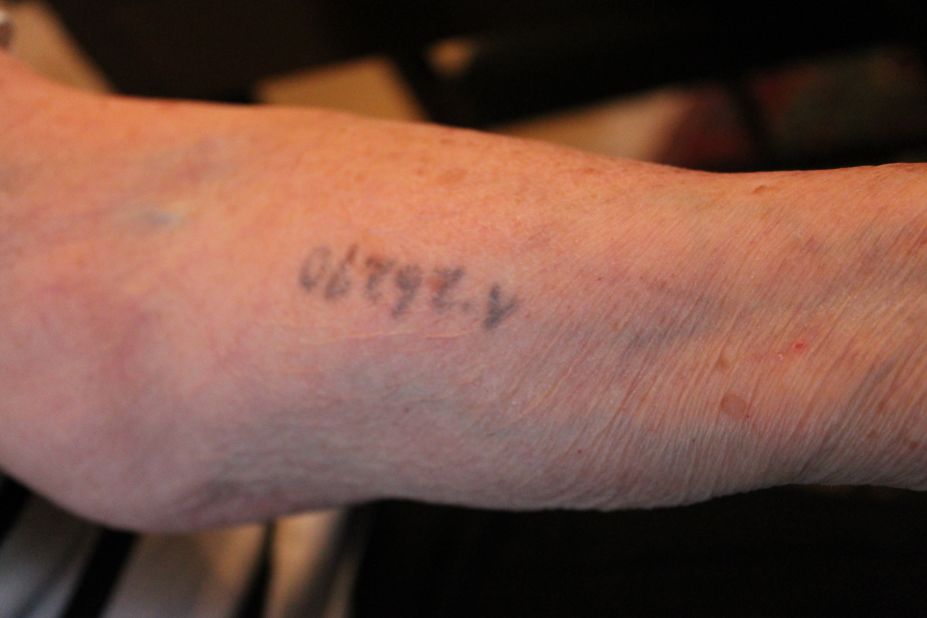 Rozalia shows the tattoo that still remains on her arm from her days at the death camp. Rozalia lost her family and her youth in the Holocaust, but she never lost her will to live.