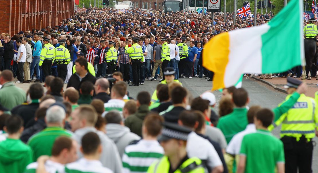 Celtic and Rangers fans are separated by Police outside Ibrox Stadium before an Old Firm fixture in 2011.