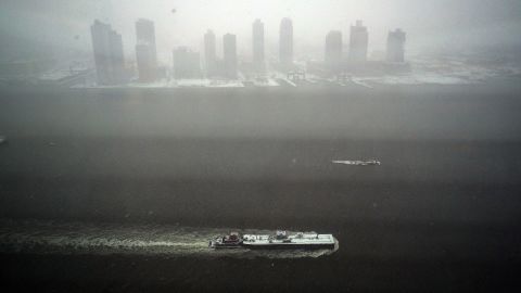 A tugboat sails on the East River in New York on January 26.