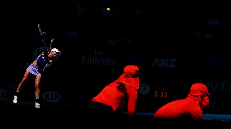 Johanna Larsson serves to Agnieszka Radwanska during a second-round match at the Australian Open on Thursday, January 22.